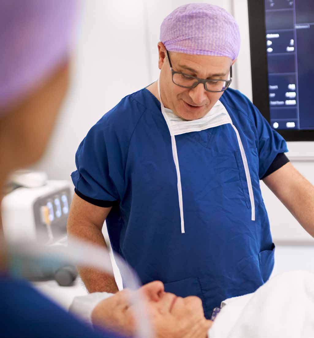 Clinician attending to a patient before an interventional procedure